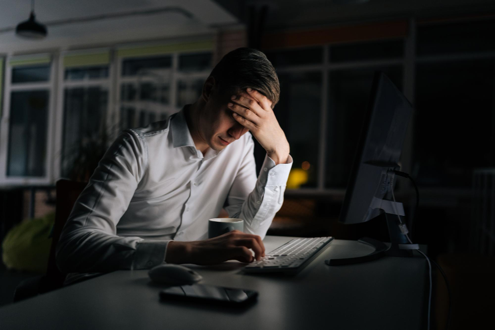 Taxpayer reviewing financial documents and HMRC payment options for outstanding tax bill in the UK