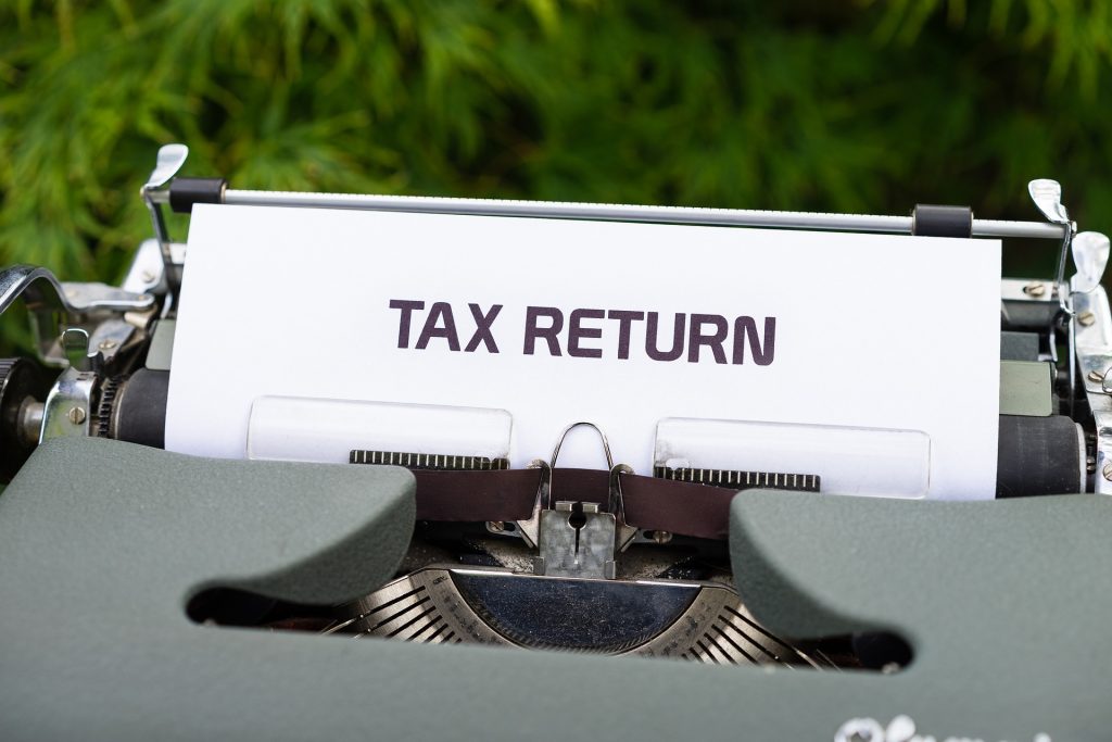 UK taxpayer reviewing overdue tax returns and increasing HMRC penalties and interest